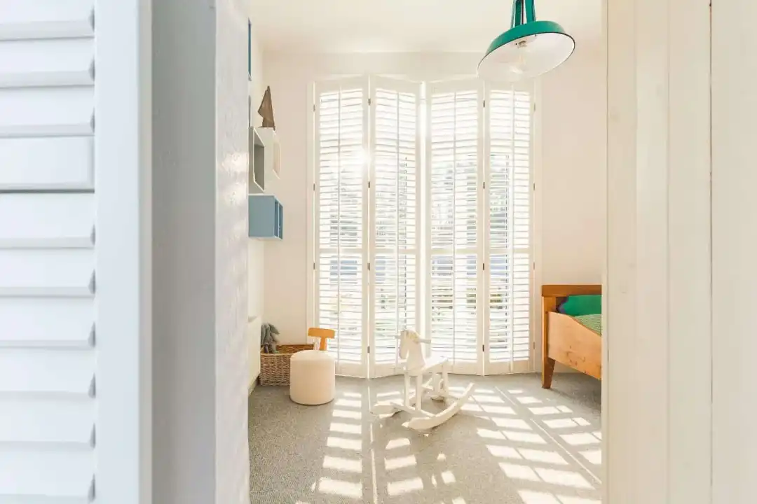 Plantation shutters on unique shaped windows in Rockingham