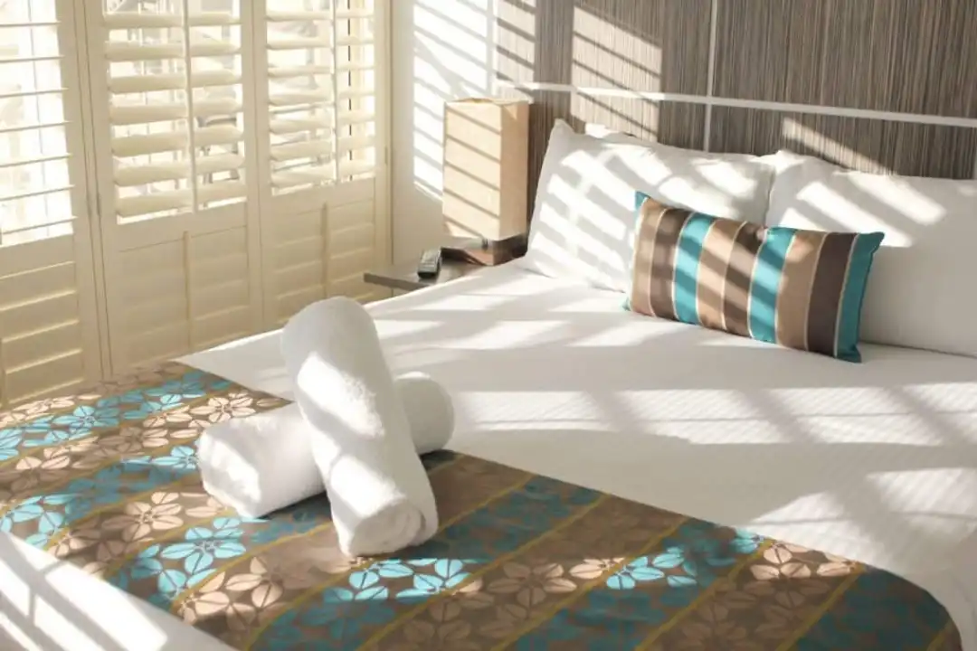 Elegant window shutters in a Mandurah bedroom